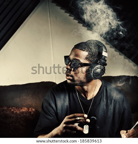 man in music studio smoking weed