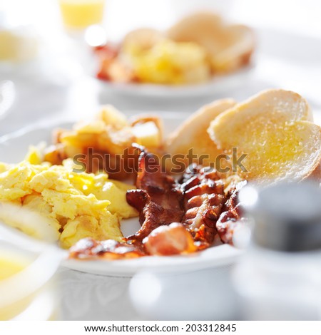 scrambled eggs and bacon breakfast meal