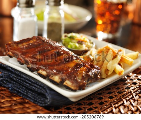 barbecue rib meal with cole slaw and french fries