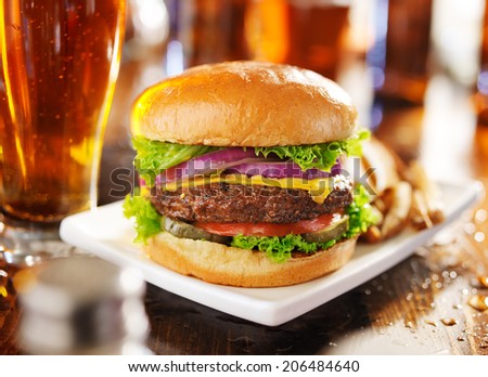 hamburger with fries and beer shot in panorama style