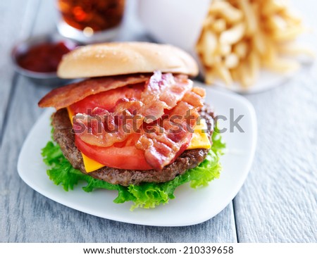 bacon cheeseburger with fries and cola