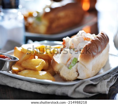 lobster roll with french fries and ketchup