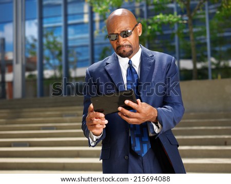 cool professional business executive with tablet