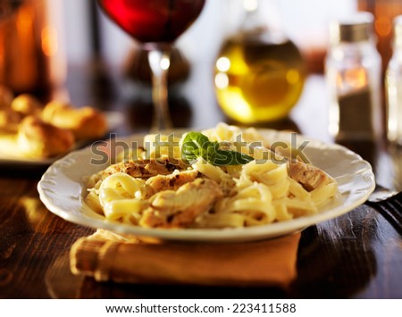 fettuccine alfredo with grilled chicken dinner at night