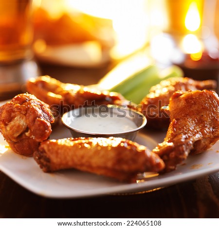 buffalo barbecue hot chicken wings around ranch sauce with celery