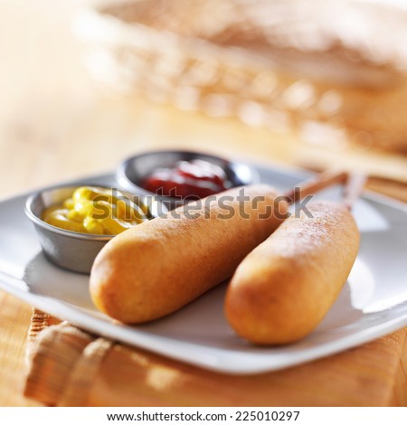corn dogs with ketchup and mustard