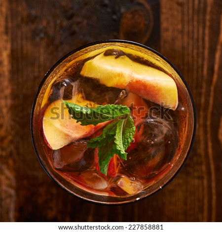 iced peach tea cocktail over head photo