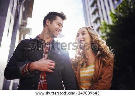 romantic couple walking through downtown los angeles