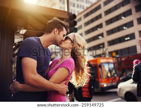 romantic couple kissing in down town los angeles