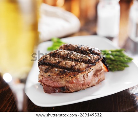 grilled steak filet with white wine and asparagus