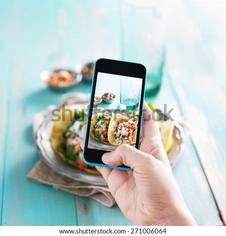 taking photo of tacos with smart phone