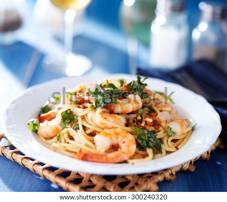 shrimp spaghetti pasta with fresh basil and crushed red pepper