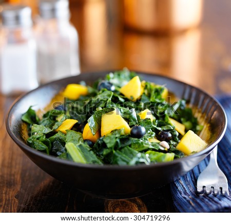 bowl of healthy mango and kale salad