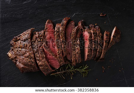 grilled flat iron steak shot in flat lay style from overhead