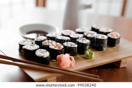 Sushi - Tuna and salmon maki roll with ginger and wasabi