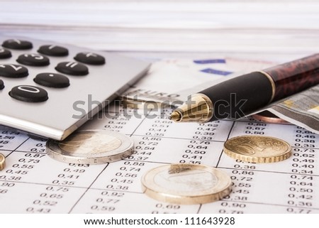 Money bills and calculator accounti ng Money bills and calculator accounti ng