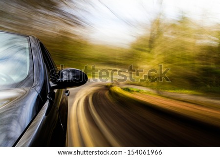 Car driving fast in turn.