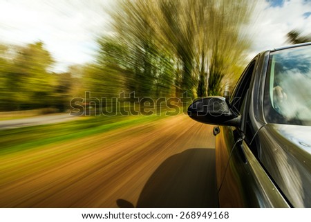 unfocused Car speeding.