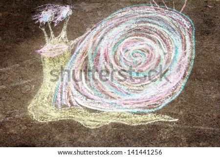 Children drew a snail on asphalt