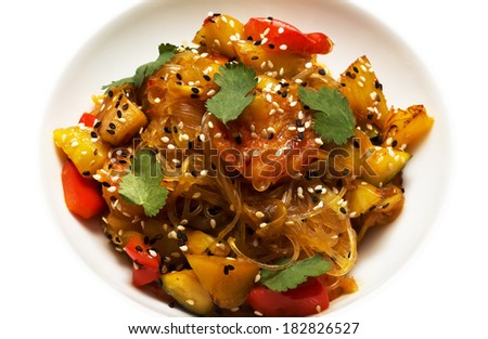 Salad with vegetables, rice noodles and sesame seeds