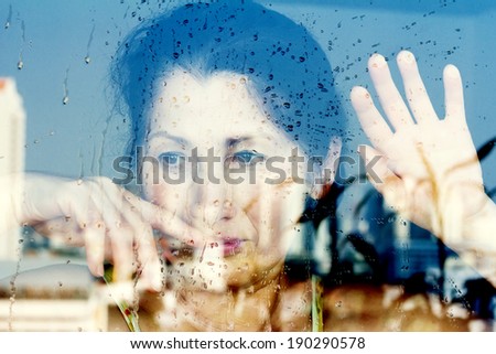 Hands of woman at the window