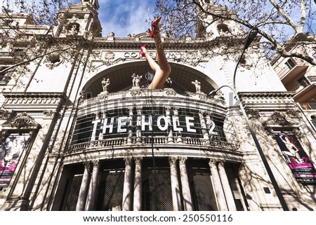 Barcelona, Spain - January 28, 2015: Art installation of woman legs at the facade of the Cinema Coliseum  in Barcelona.