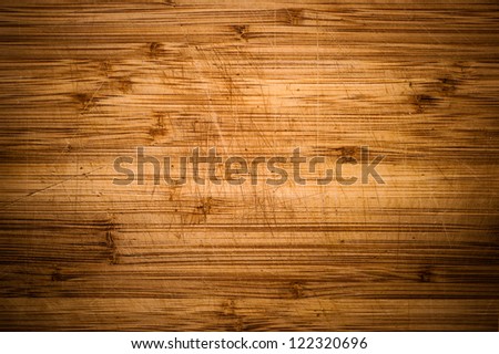 Wooden desk background with vignette. Wood background. Desk marks after using as a kitchen desk.