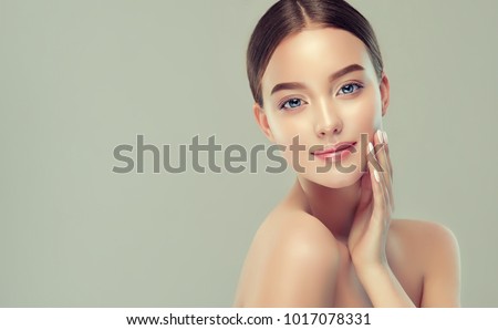 Beautiful young woman with clean fresh skin. Girl beauty face care. Facial  treatment.