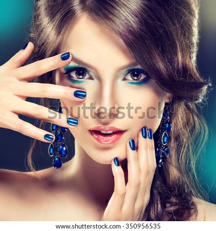 Fashion Girl Portrait    Girl with trendy turquoise makeup . . Jewelry earrings and    bijouterie  accessories