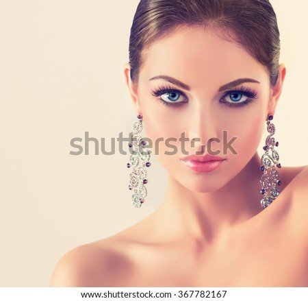 fashion woman with jewelry set . girl with   fashionable jewelry , earrings