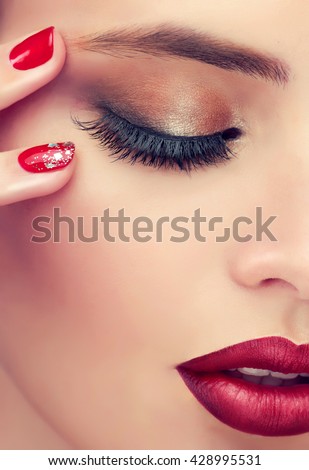 Luxury fashion style, manicure nail , cosmetics and makeup . Red lips  and  long eyelashes  .