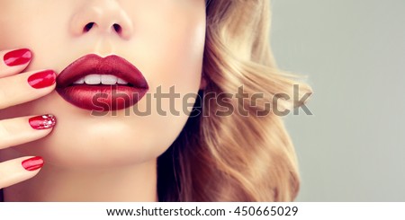 Luxury fashion style, manicure nail , cosmetics and makeup . Red  beauty lips  .