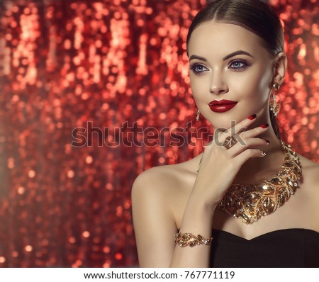 Beautiful girl with set jewelry .   Woman in a necklace with a ring, earrings and a bracelet. Beauty and accessories.