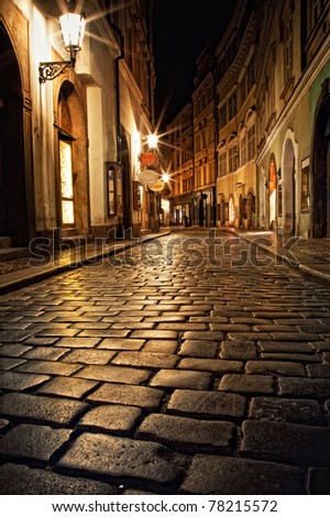 mysterious narrow alley with lanterns in Prague at night