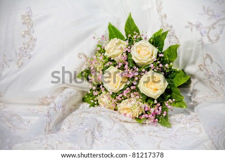 stock photo wedding bouquet on wedding dress background stock photo wedding bouquet on wedding dress background