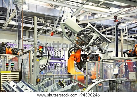 Robotic Arms In A Car Factory
