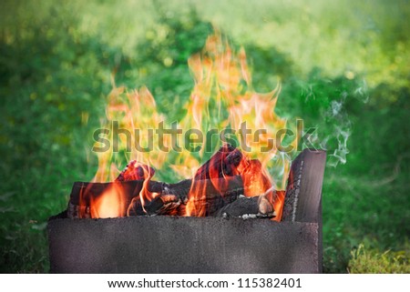 preparing fire for outdoor grill