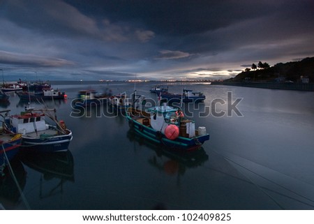 Fishing Boats at sunset in Patagonia, Chile