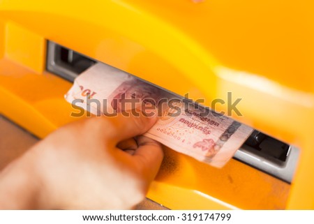 Woman Receiving Money from the ATM.