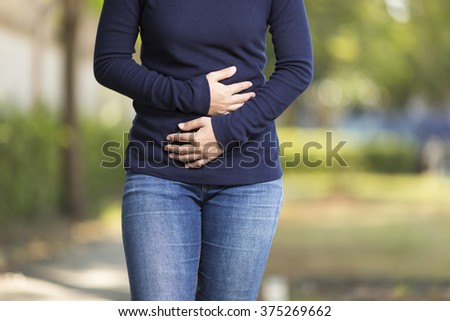 Woman Has Stomach Ache at Park