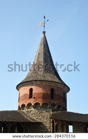 Wall and tower of a medieval European fortress.
