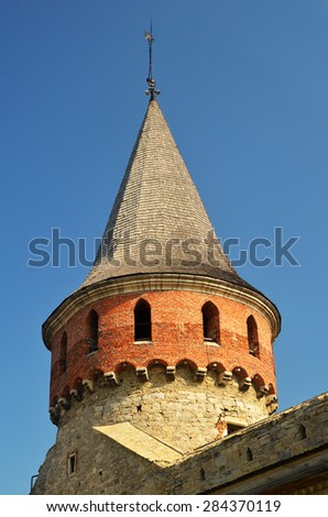 Wall and tower of the Kamianets-Podilskyi Castle made of stones. Medieval European fortification