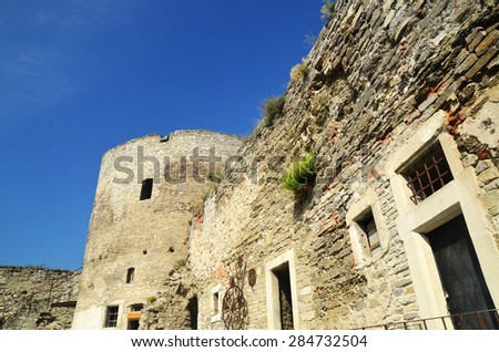 Stone walls of the old European fortress in Kamianets-Podilskyi city in Ukraine. Medieval architecture ruins