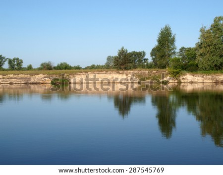 Trees reflection in Desna river (Ukraine). Beautiful nature scene