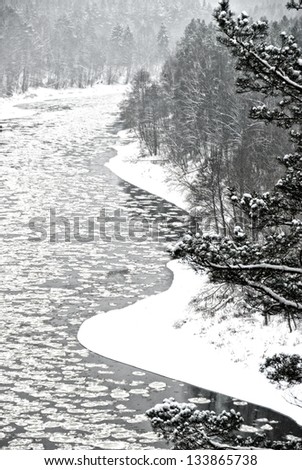 Lithuanian european winter landscape with snow and river, river and trees in winter season,river with the ice and snow in winter time background, black and white photo, winter landscape,Christmas time