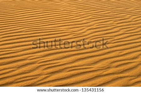 Sand dunes, orange, dramatic sunset landscape in desert,golden sand dunes in the Sahara Desert, Libya, sand dunes at sunset in Sahara,desert texture,beautiful structure of dense yellow sand,hot summer