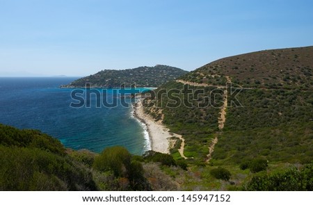 View of Portu Sa Ruxi, sardinian landscape with the wild beach and small village far away, town of Portu Sa Ruxi, Sardinia, Italy, holidays in Sardinia, Sardinia island, wild nature, nature panorama