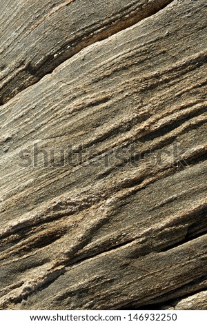 Surface of the old stone background texture of rock, stone pattern, granite material. A high quality golden bright color stone texture, stone pattern close up, stone canvas.Grunge texture