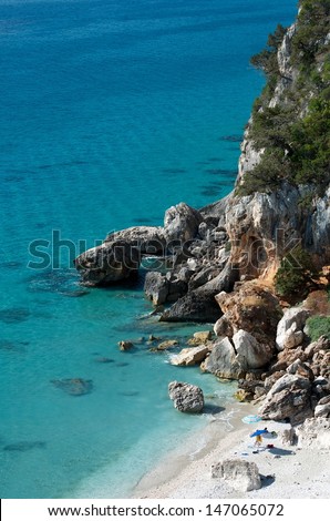 Crystal water in Cala Fuili in Sardinia,mediterranean sea,turquoise water on summer in Sardinia,Italy,view to beautiful beach in Cala Gonone, sardinian landscape with wild beach, holidays in Sardinia