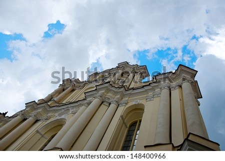 Vilnius,Lithuania.Vilnius University (the oldest university in Baltic states and one of the oldest in Eastern Europe).Vilnius University. Old church in dramatic sky background